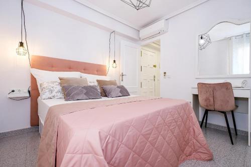 Postel nebo postele na pokoji v ubytování Holiday Playa Jardin IV