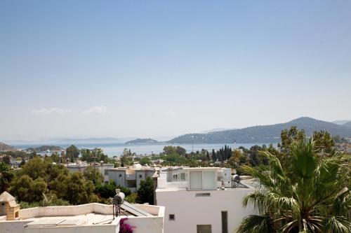 a view of the water from a building at Luxury Villa in Türkbükü Bodrum Turkey close to Maca Kızı in Bodrum City