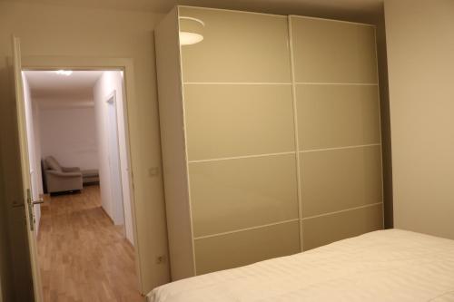 a bedroom with a large sliding closet door at Penthouse in Vienna - near metro in Vienna