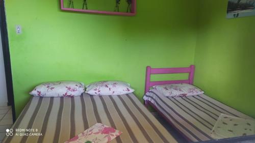 Postel nebo postele na pokoji v ubytování Flats quase beira mar ar piscinas até 8 pessoas caseiro