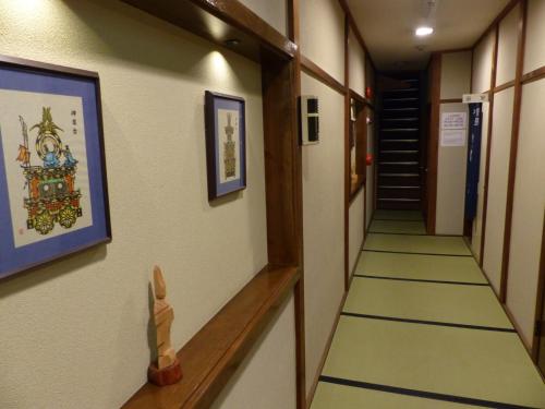 a corridor of a hallway with a long aisle at Minshuku Kuwataniya - Vacation STAY 96483v in Takayama