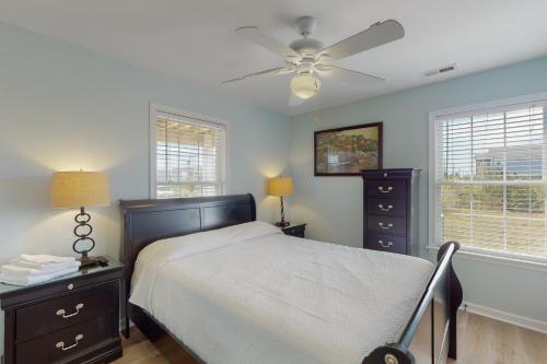 a bedroom with a bed and a ceiling fan at Adel's Place #8-S in Salvo