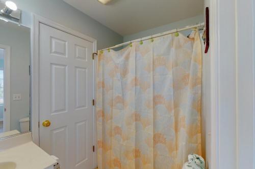 a bathroom with a shower with a shower curtain at Adel's Place #8-S in Salvo