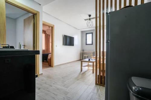 a room with a kitchen and a living room at Modern Unit Well located in Casablanca