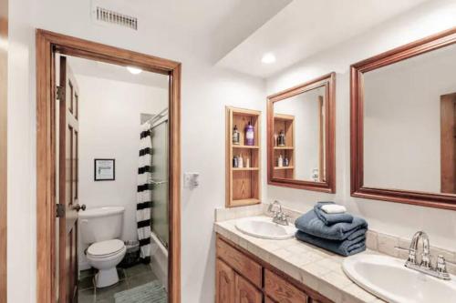 a bathroom with two sinks and a toilet at Malibu Ocean Villa with King Bed, Hot Tub, Beach, BBQ in Malibu