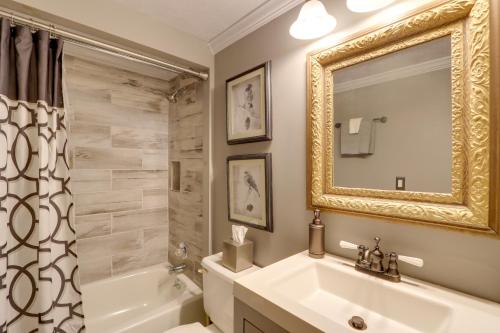 a bathroom with a sink and a tub and a mirror at Blue Ridge Getaway with Hot Tub and Seasonal View! in Blue Ridge