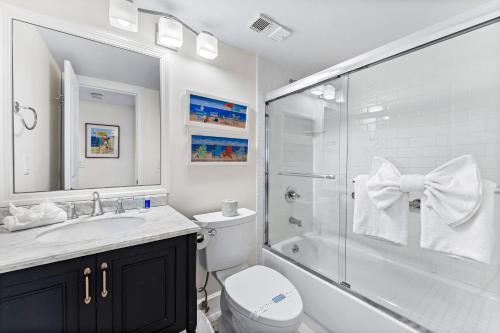 a bathroom with a toilet sink and a shower at Stay Siesta Dunes, #300; by Beachside Management in Siesta Key