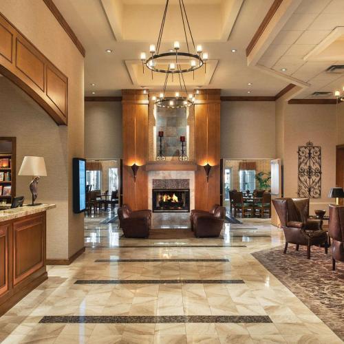 a lobby with couches and a fireplace at Sonesta Suites Scottsdale Gainey Ranch in Scottsdale