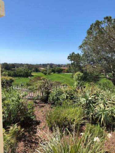 a field with plants and a fence and trees at 30 PCT OFF! Malibu Romantic Suite, Ocean View, Beach in Malibu