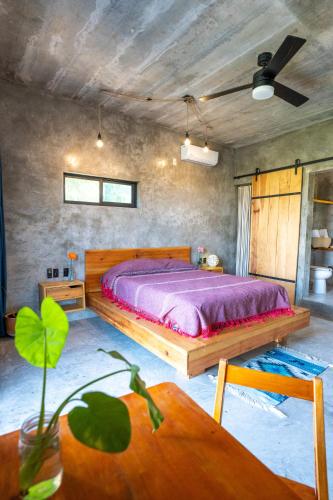 a bedroom with a large bed in a room at Casa Monika Vista Suit in Puerto Escondido