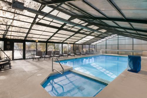 a large swimming pool in a building at The Inn at Tomichi Village in Gunnison