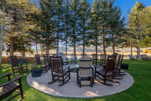 a group of chairs and tables in a park at The Inn at Tomichi Village in Gunnison