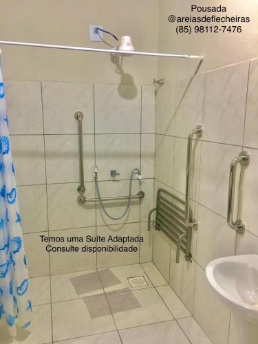 a bathroom with a shower and a sink at Pousada Areias de Flecheiras in Flecheiras