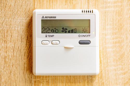 a thermometer sitting on top of a wooden table at Apartamentos Villa Zoila Nigrán in Nigrán