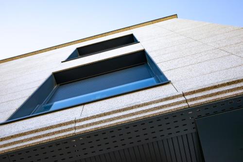 a window on the side of a building at Apartamentos Villa Zoila Nigrán in Nigrán