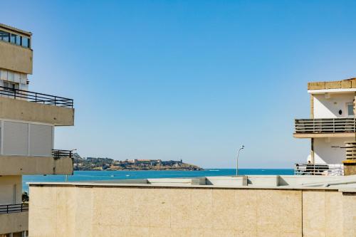 a view of the ocean from a building at Apartamentos Villa Zoila Nigrán in Nigrán