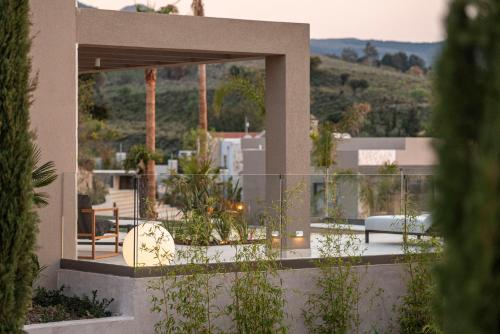 a house with a balcony with a view at Maravilla Luxury Living in Kos Town