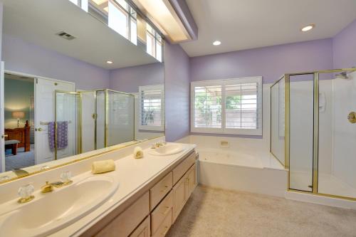 a bathroom with two sinks and a shower at Bella Vista La Quinta Home with Pool and Spa! in La Quinta