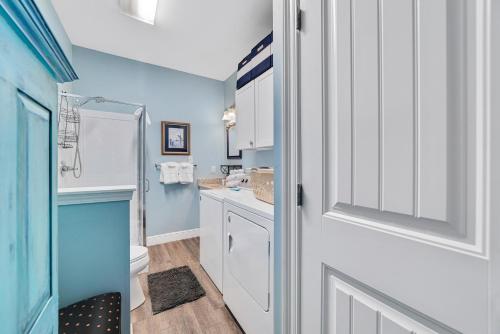 A kitchen or kitchenette at Walk to Beach, Secluded, Gazebo with Grill, 1GiG WiFi, Washer and Dryer, Games