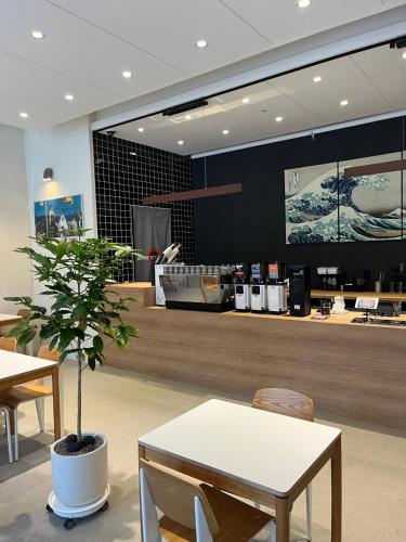 a store with a table and a potted plant at Ramada by Wyndham Seoul Dongdaemun in Seoul
