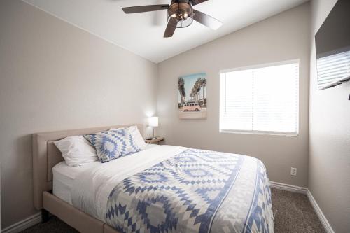 a bedroom with a bed and a ceiling fan at Beautiful Las Vegas Home in Las Vegas