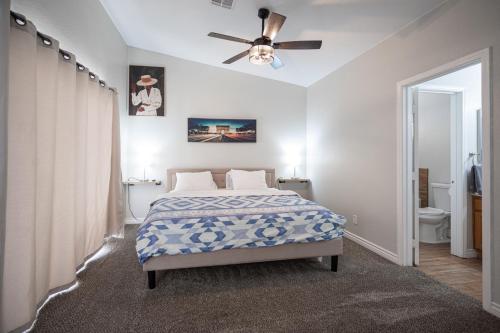 a bedroom with a bed and a ceiling fan at Beautiful Las Vegas Home in Las Vegas