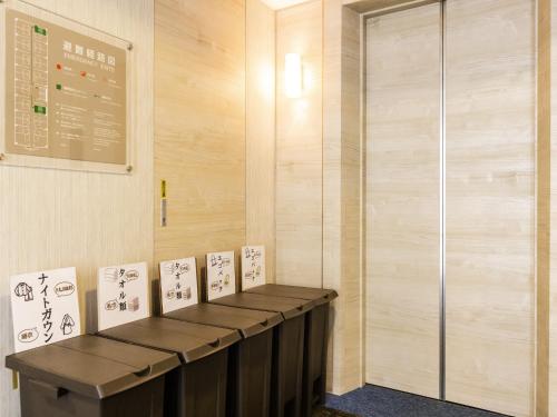 a room with a table with signs on it at Hotel Wing International Nagoya in Nagoya