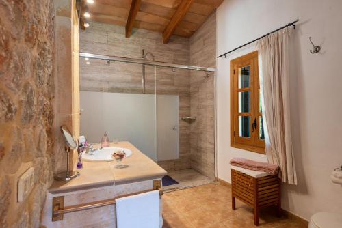 a bathroom with a sink and a shower at Es Pujolet - Alcudia in Port d'Alcudia