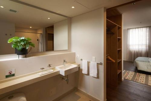 a bathroom with a sink and a mirror at Caluce Apt 3D by Letoh in Chía