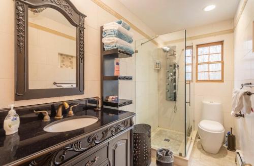a bathroom with a sink and a shower at Villa Verde B&B, Greenwood Lake, NY in Monroe