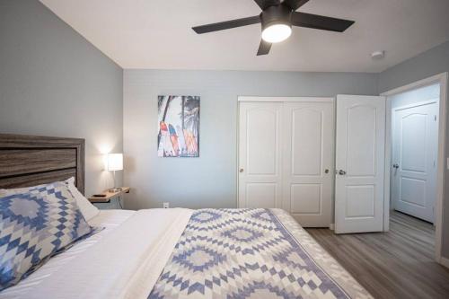 a bedroom with a bed with a ceiling fan at Gorgeous Las Vegas home with RV parking in Las Vegas