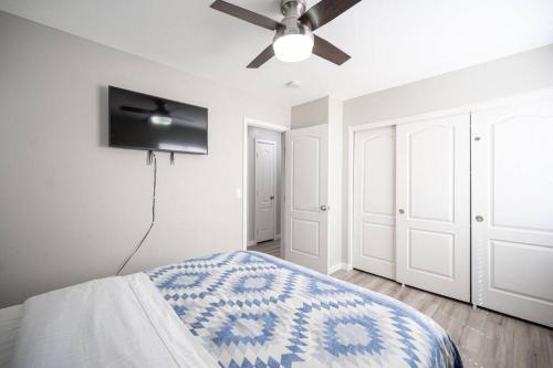 a bedroom with a bed and a ceiling fan at Gorgeous Las Vegas home with RV parking in Las Vegas