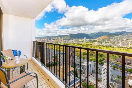 a balcony with a view of a city at Panoramic Mountain View Condo with Free Parking! in Honolulu