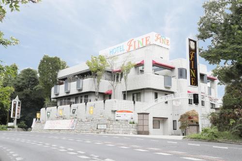 a white building on the side of a street at Hotel Fine Rokko Kita Ichibanchi in Kobe