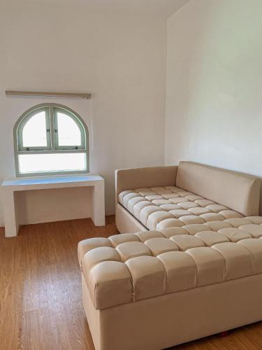 Ένα ή περισσότερα κρεβάτια σε δωμάτιο στο Renjana Beach House