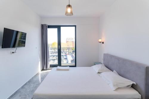 En eller flere senge i et værelse på Luxury residence Mamaia