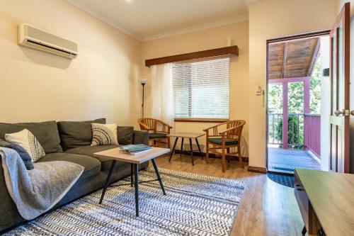 a living room with a couch and a table at Margs Break at The River in Margaret River Town