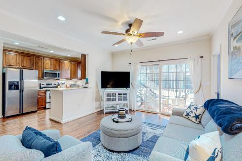 a living room with a ceiling fan and a kitchen at The Tides Sandy Bottom Cir Unit 107 in Rehoboth Beach