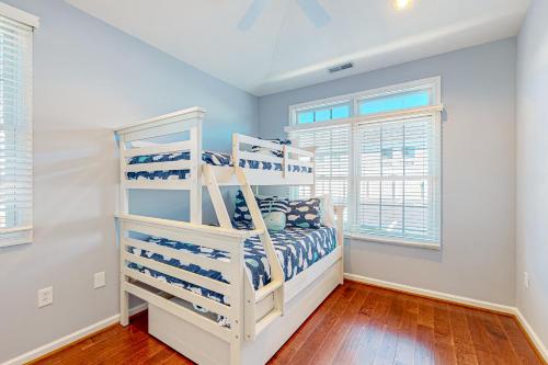a bedroom with two bunk beds and a window at The Tides Sandy Bottom Cir Unit 107 in Rehoboth Beach