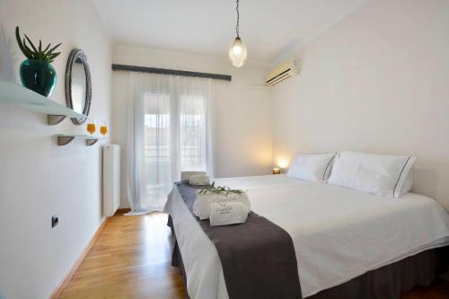 Postel nebo postele na pokoji v ubytování Vassiliki Town Suite