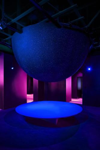 a stage with a blue floor and purple lights at Zonar Zagreb by Maistra City Vibes in Zagreb