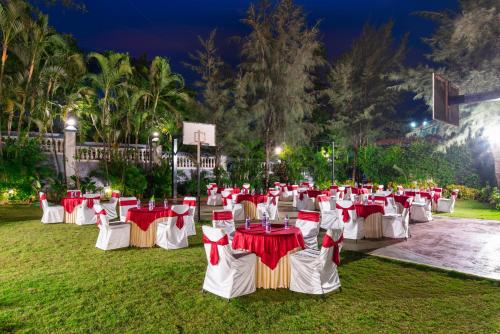 a group of tables in a park at night at Mayur Retreat & Spa in Lonavala