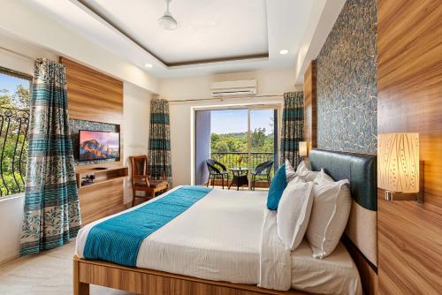 a hotel room with a bed and a window at Mayur Retreat & Spa in Lonavala