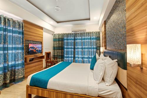 a bedroom with a bed in a room at Mayur Retreat & Spa in Lonavala