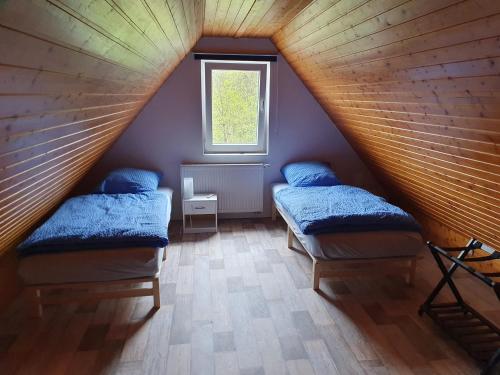 Katil atau katil-katil dalam bilik di Ferienwohnung Hartmann am Hillscheid
