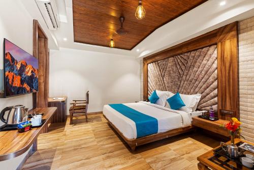 a hotel room with a bed and a desk at Mayur Retreat & Spa in Lonavala