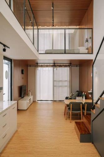 a kitchen and dining room with a table and a dining room at Little Duck Villa - Tiny House near Gedong Putih in Lembang