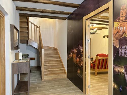 a hallway with a staircase in a house at Casa Rural Sutegia in Ziga