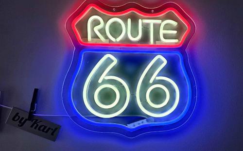 a neon sign for a route sign at Route66 apartament by Karl in Radom
