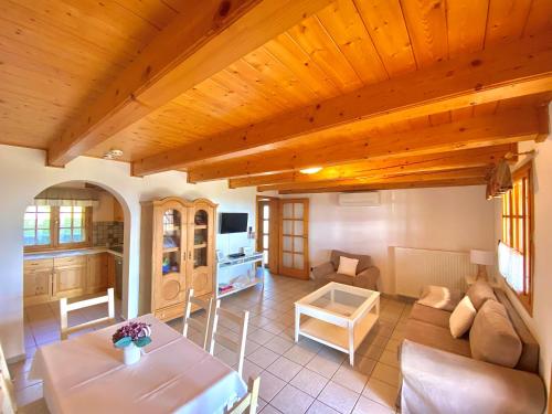 a living room with a table and a couch at BorászPorta in Villány